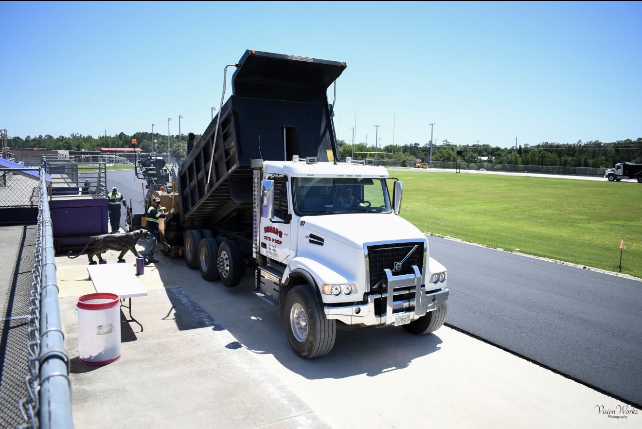 Bubba's Site Prep branded truck on stadium paving project