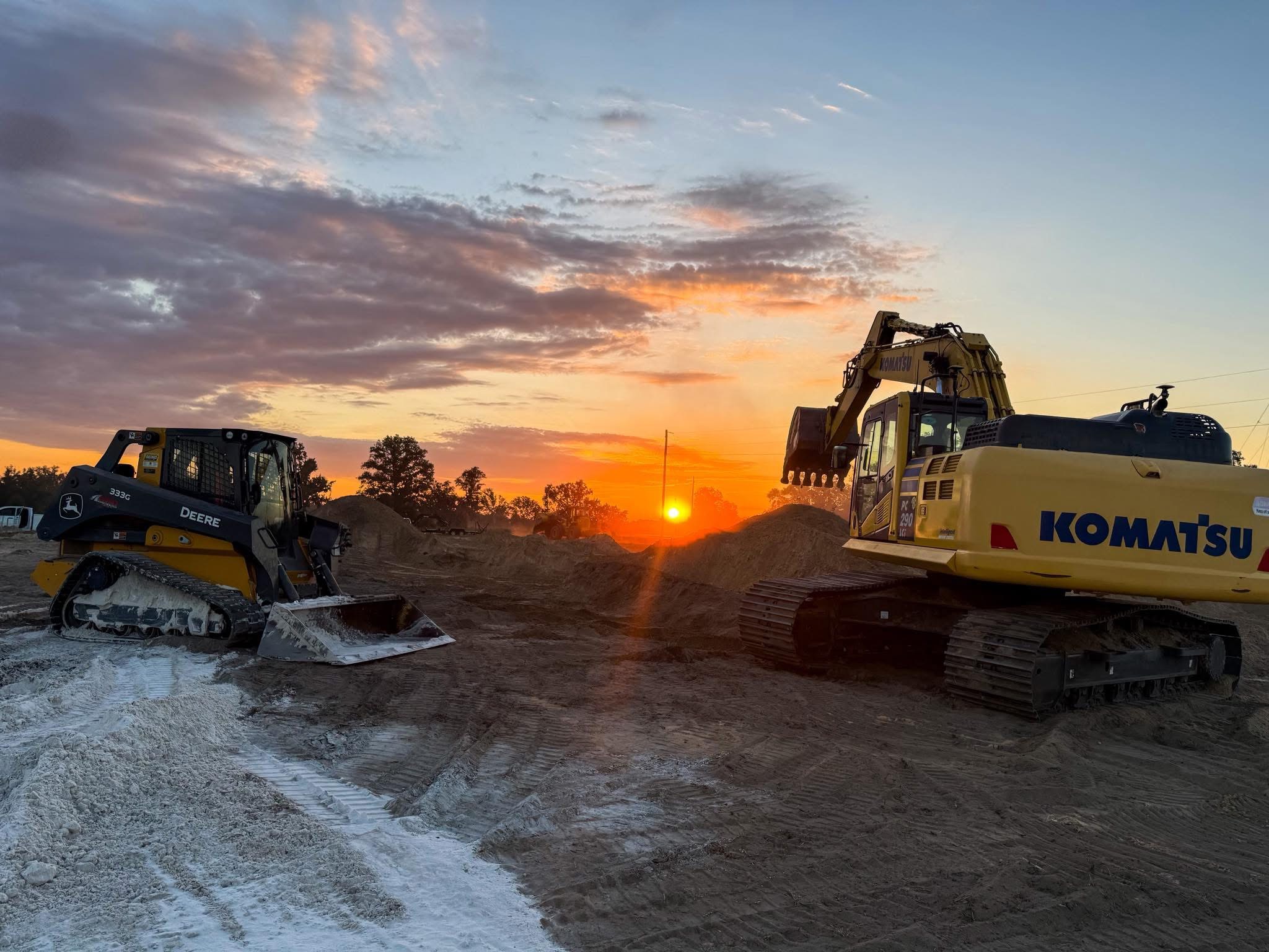 Construction equipment at sunset — North Florida site prep